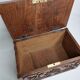 Ancien coffret en bois sculpté à décor de mascaron