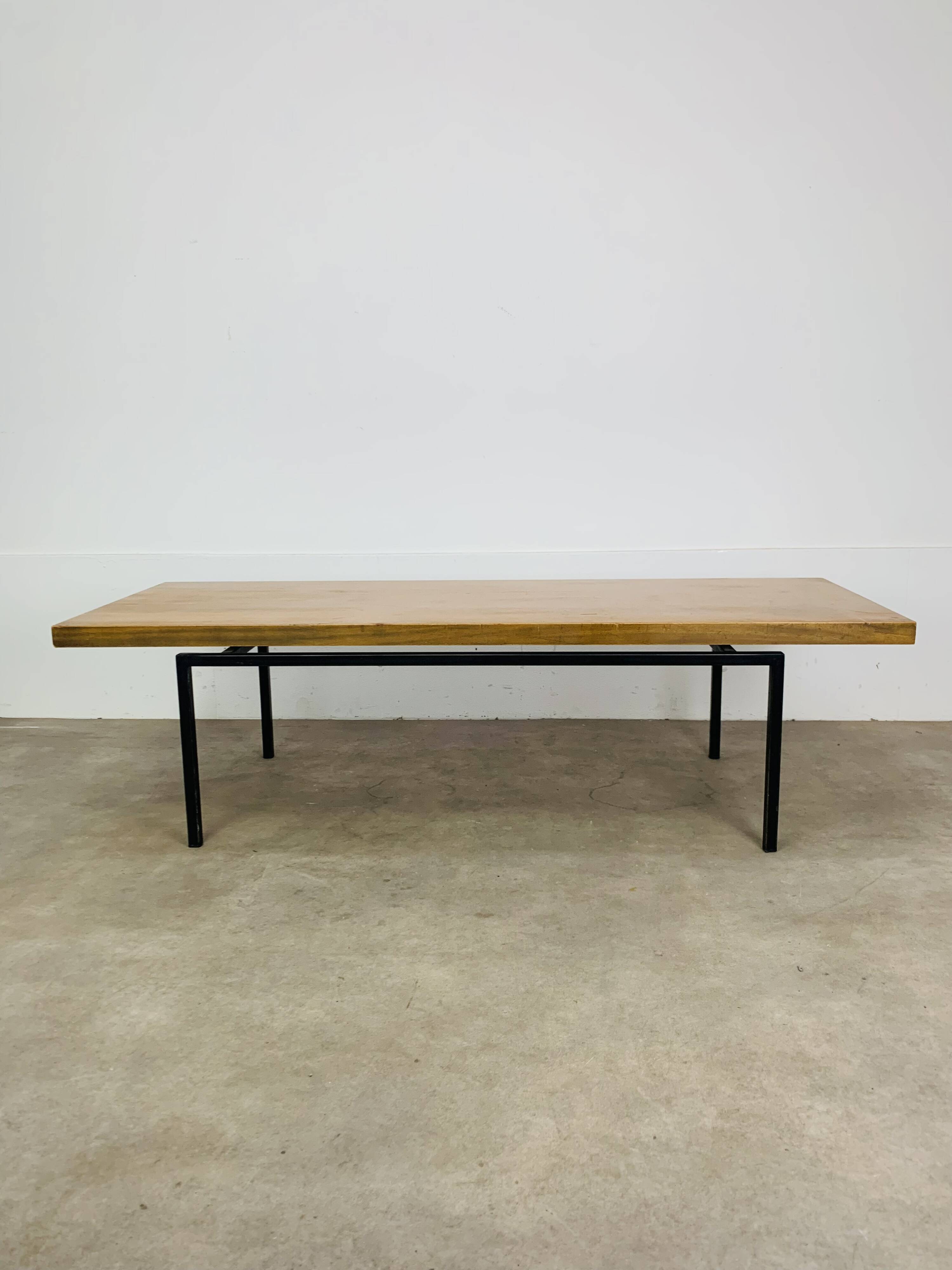 1950s modernist coffee table, wood and black metal.