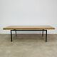 1950s modernist coffee table, wood and black metal.