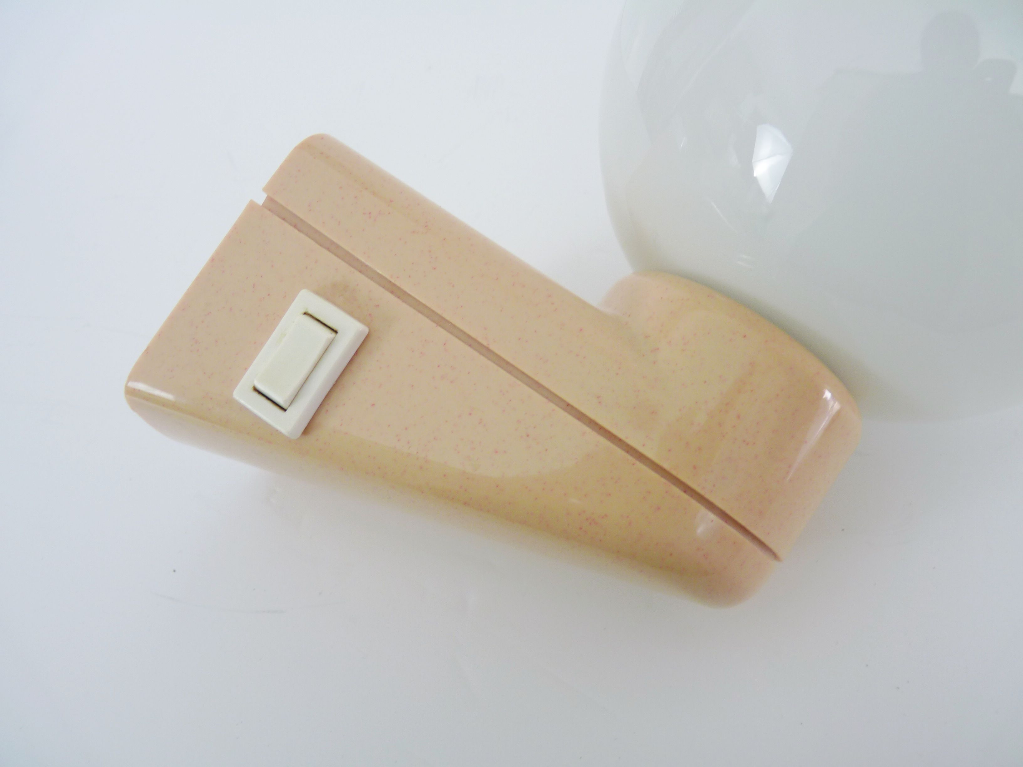 Vintage wall lamp in beige pvc with pink dot and globe in white opaline. Year 70