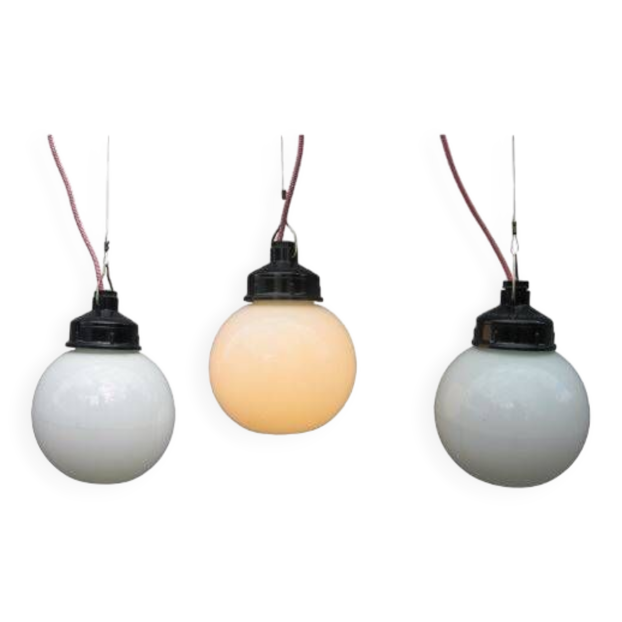 Trio of opal glass and bakelite globe pendant lights