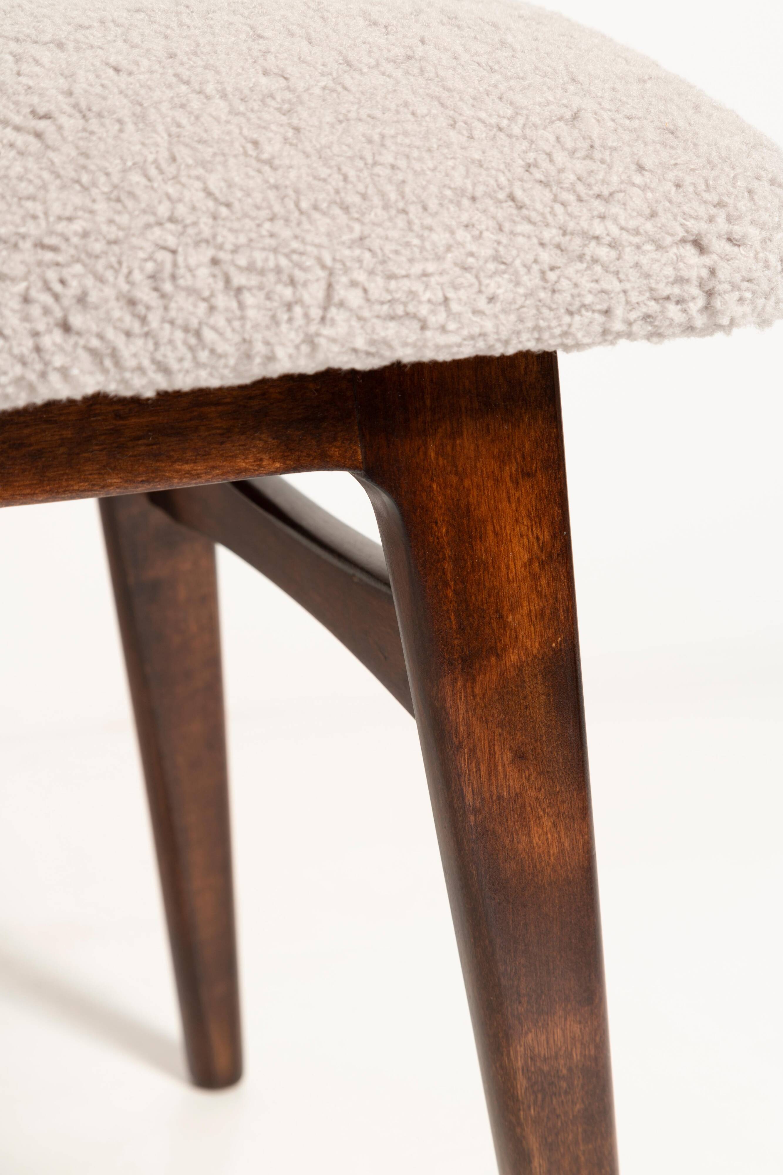 Mid-century butterfly chair, light grey boucle, dark walnut wood, Europe, 1960s.