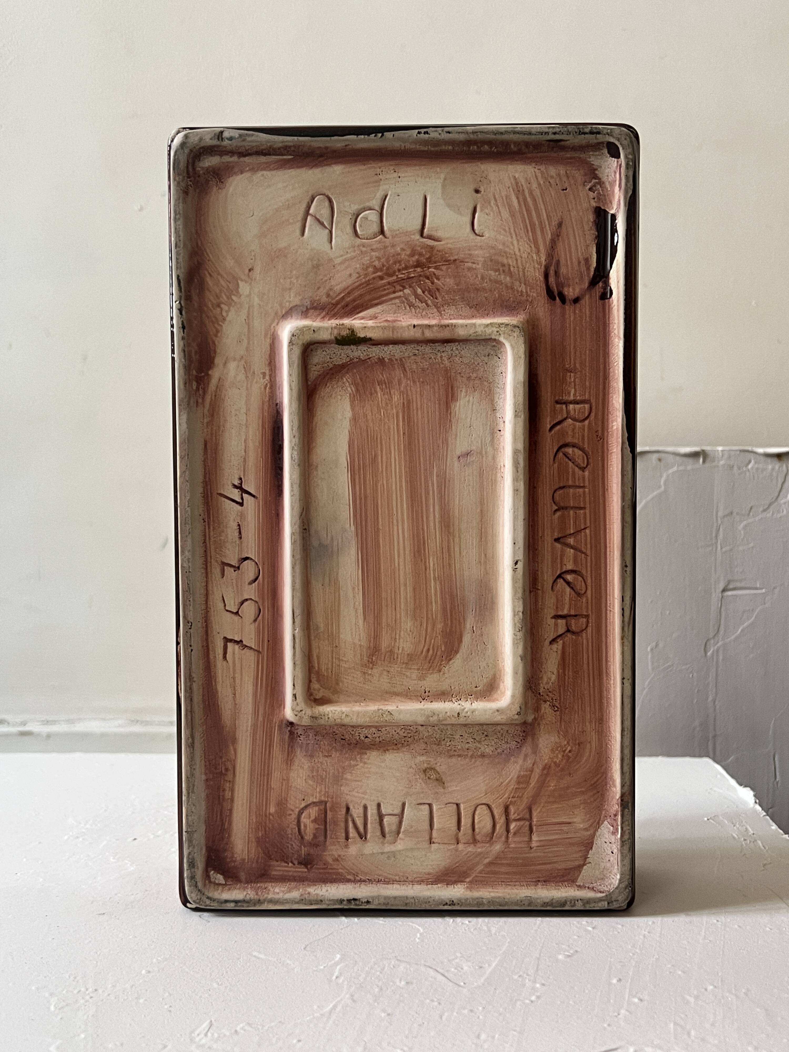 Bordeaux ceramic enamelled vide poche by Dutch artist A. Reuver, numbered.