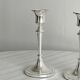 Pair of white metal candlesticks