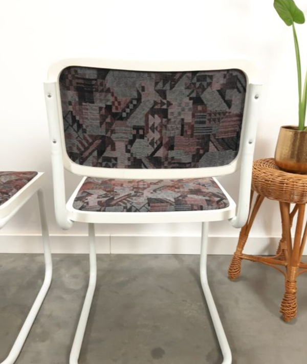 Pair of vintage tubular frame dining chairs