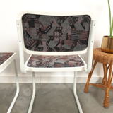 Pair of vintage tubular frame dining chairs