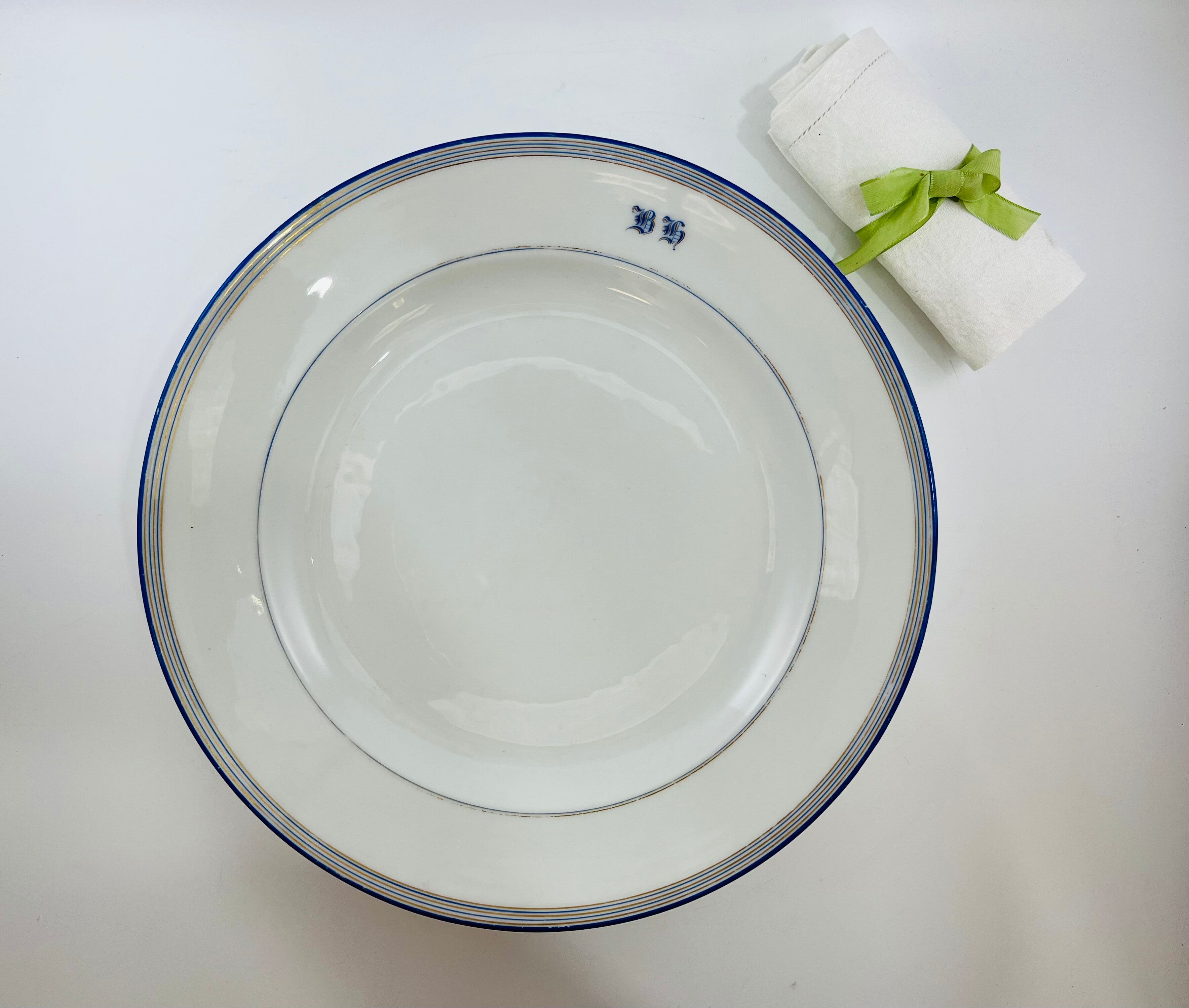 Round dish white monogrammed with blue border 34cm