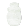 Transparent white glass jar and its cap