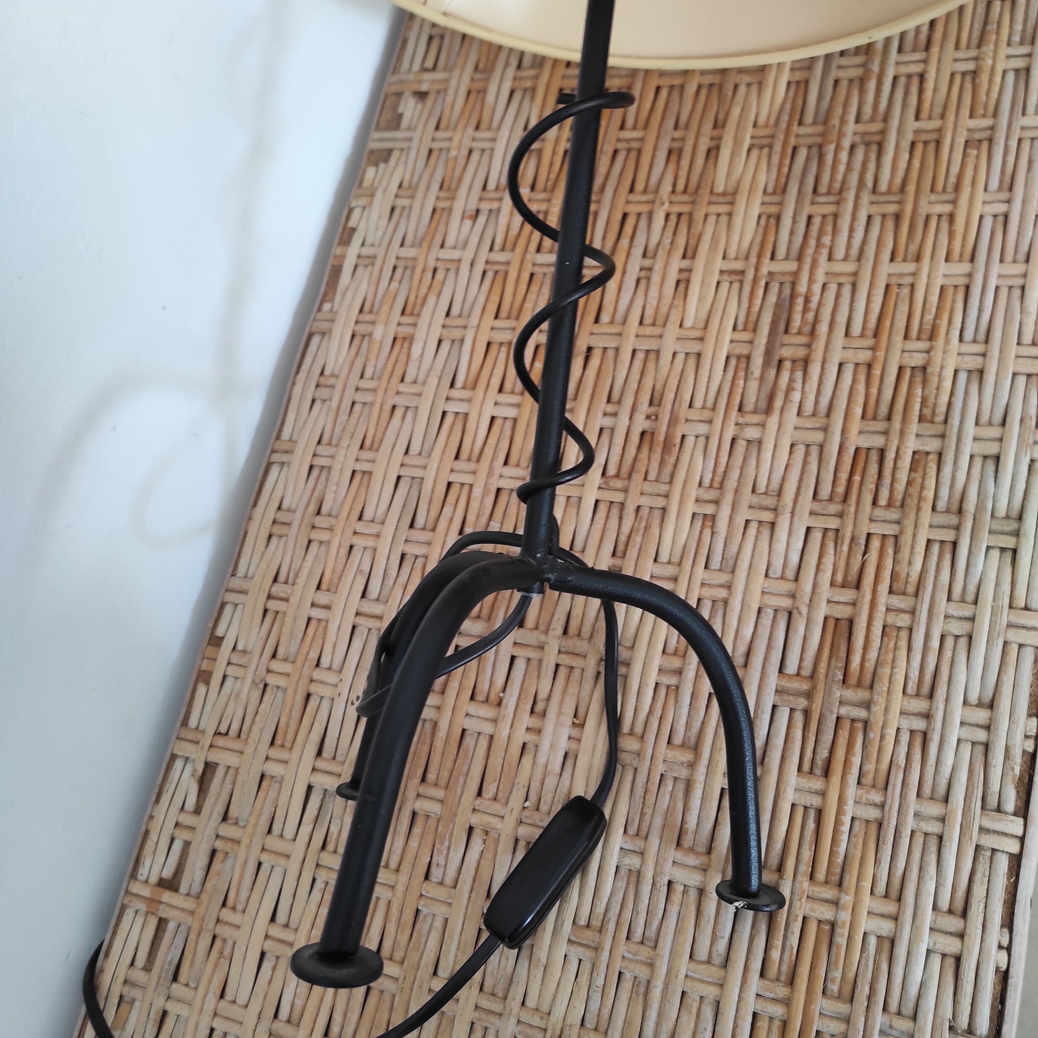 Black wrought iron table lamp and beige lampshade