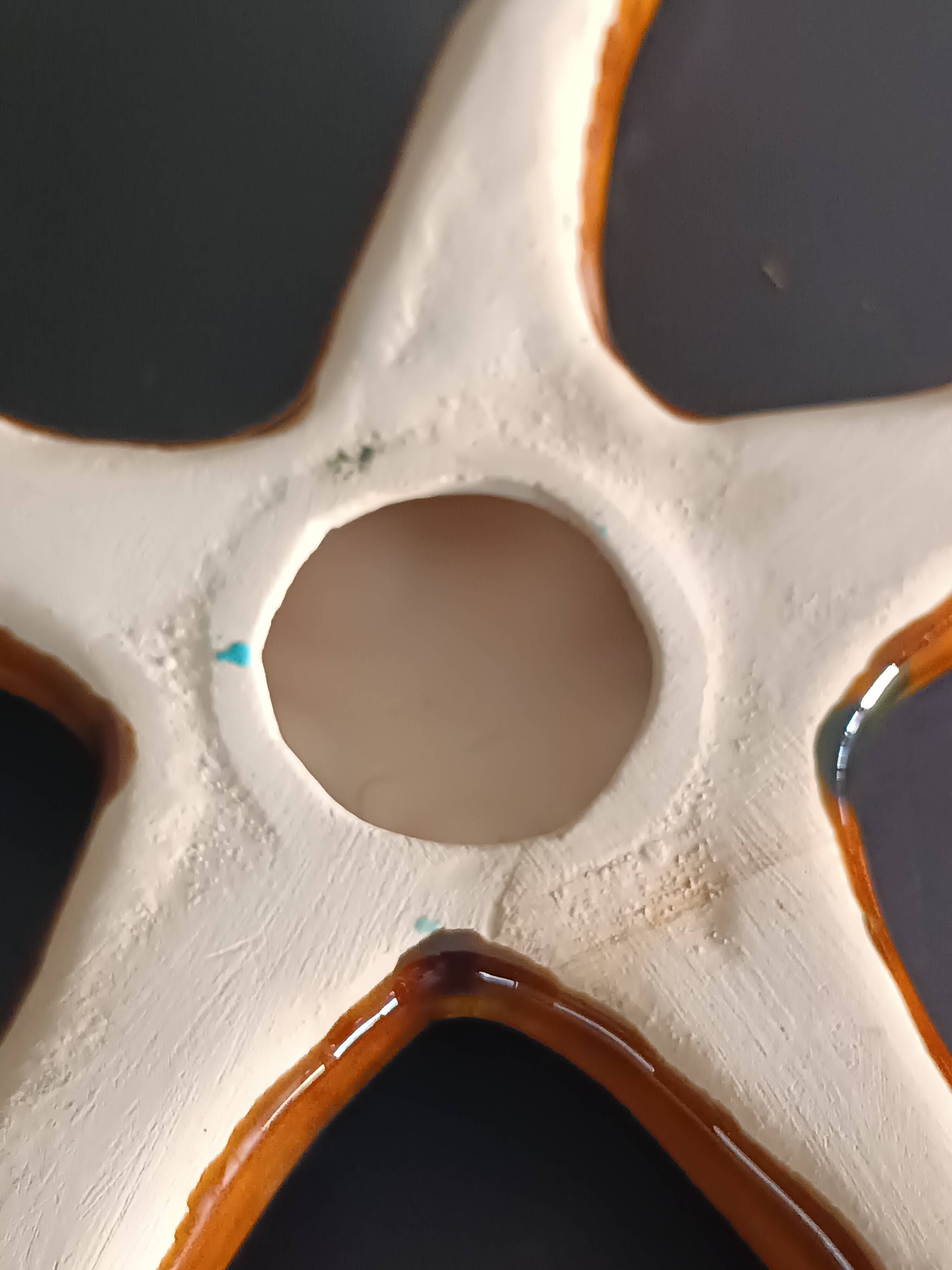 Two vintage ceramic wall pots featuring a seahorse and a starfish.