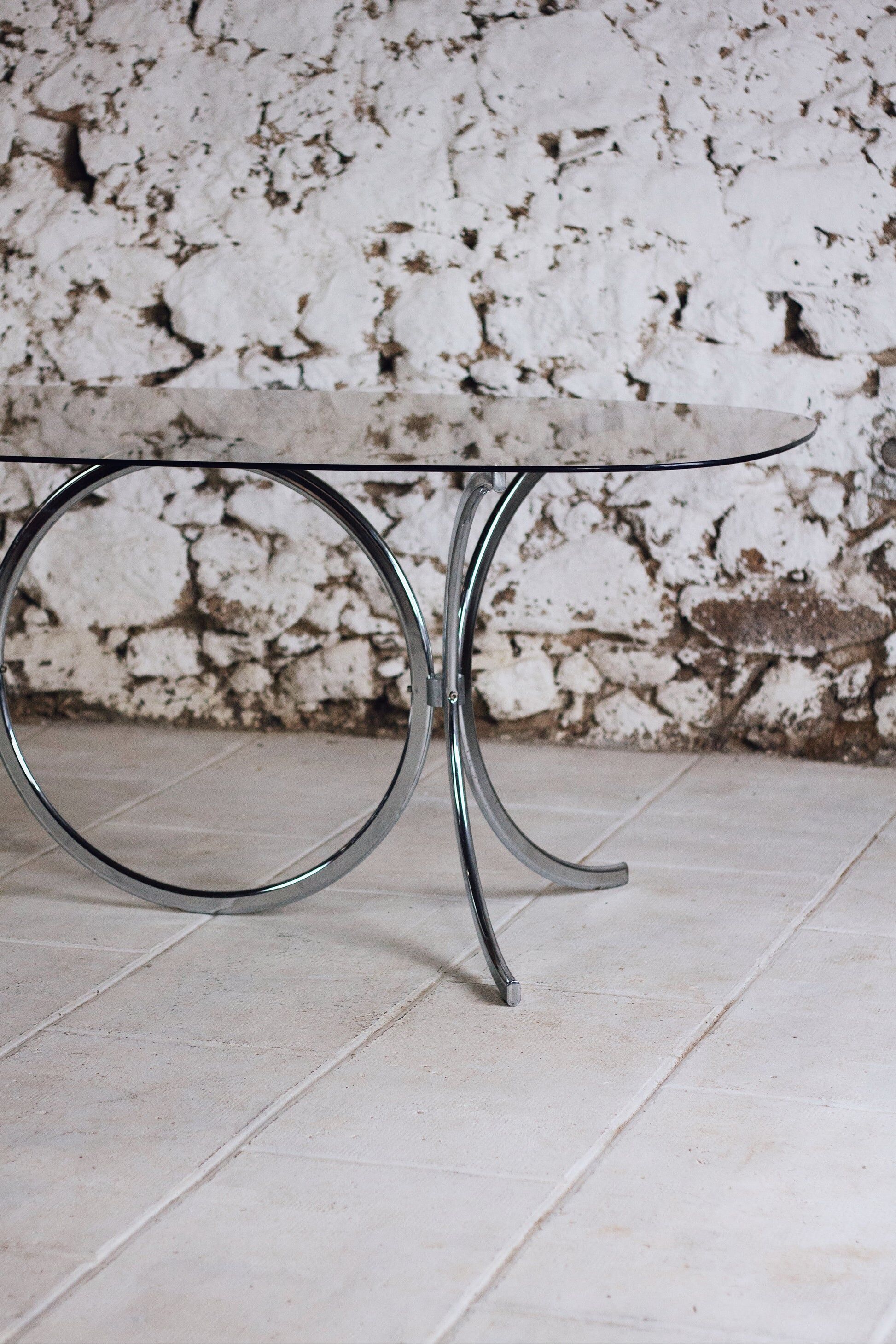 Chrome and smoked glass dining table in the style of Gastone Rinaldi, 1970.