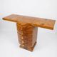 An Art Deco console made of beech wood with elm burl and 5 drawers.