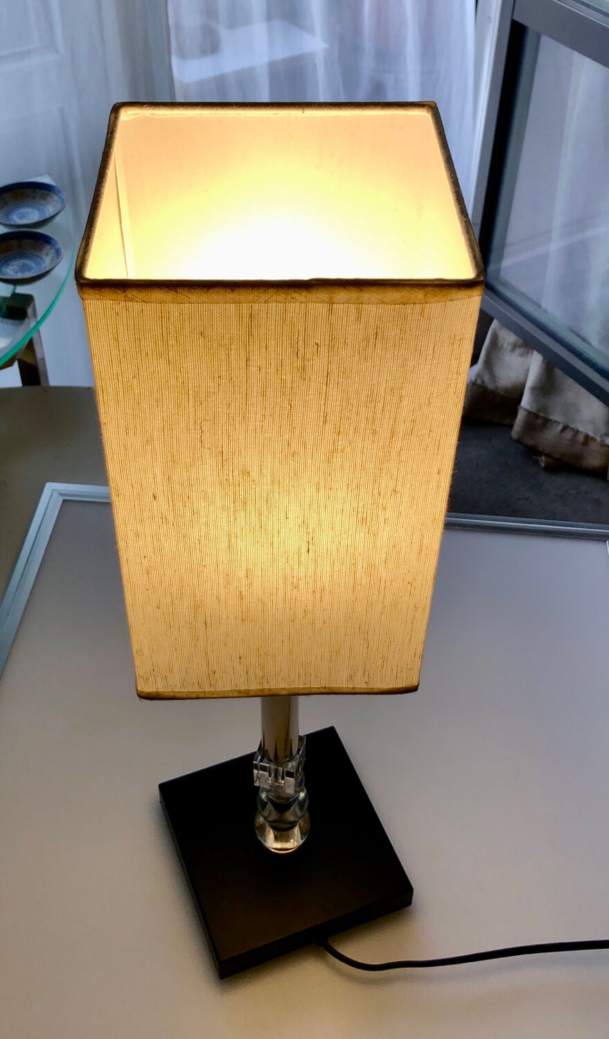 Silver floor lamp with a straight shade.