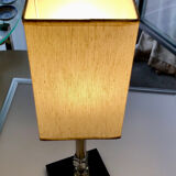 Silver floor lamp with a straight shade.