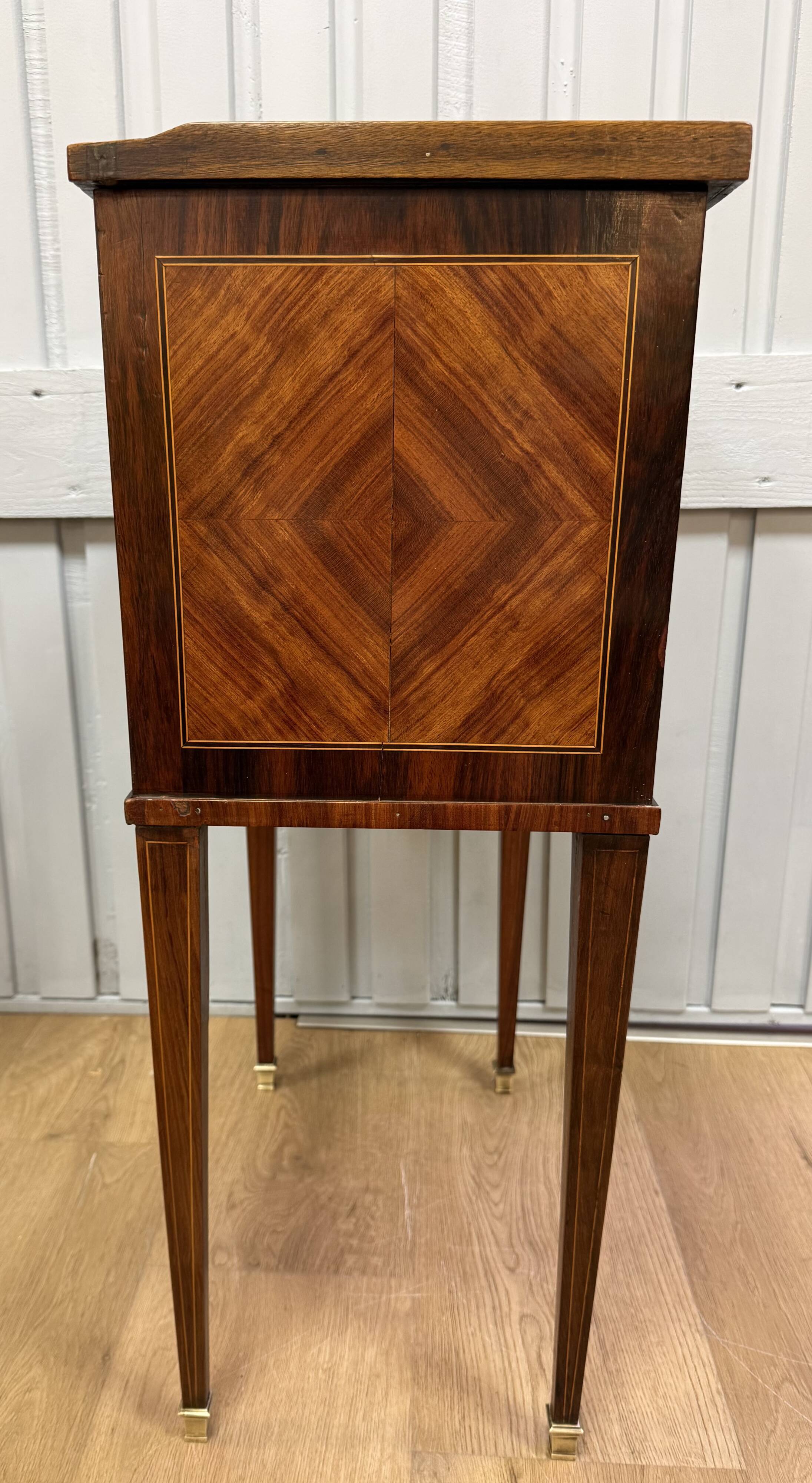Side table with a faux book front.