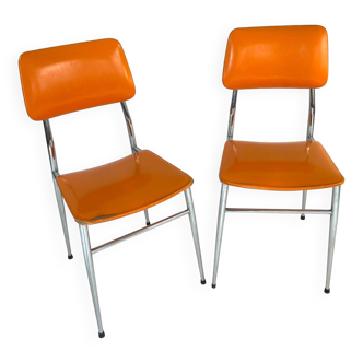 Pair of vintage orange Skaï chairs