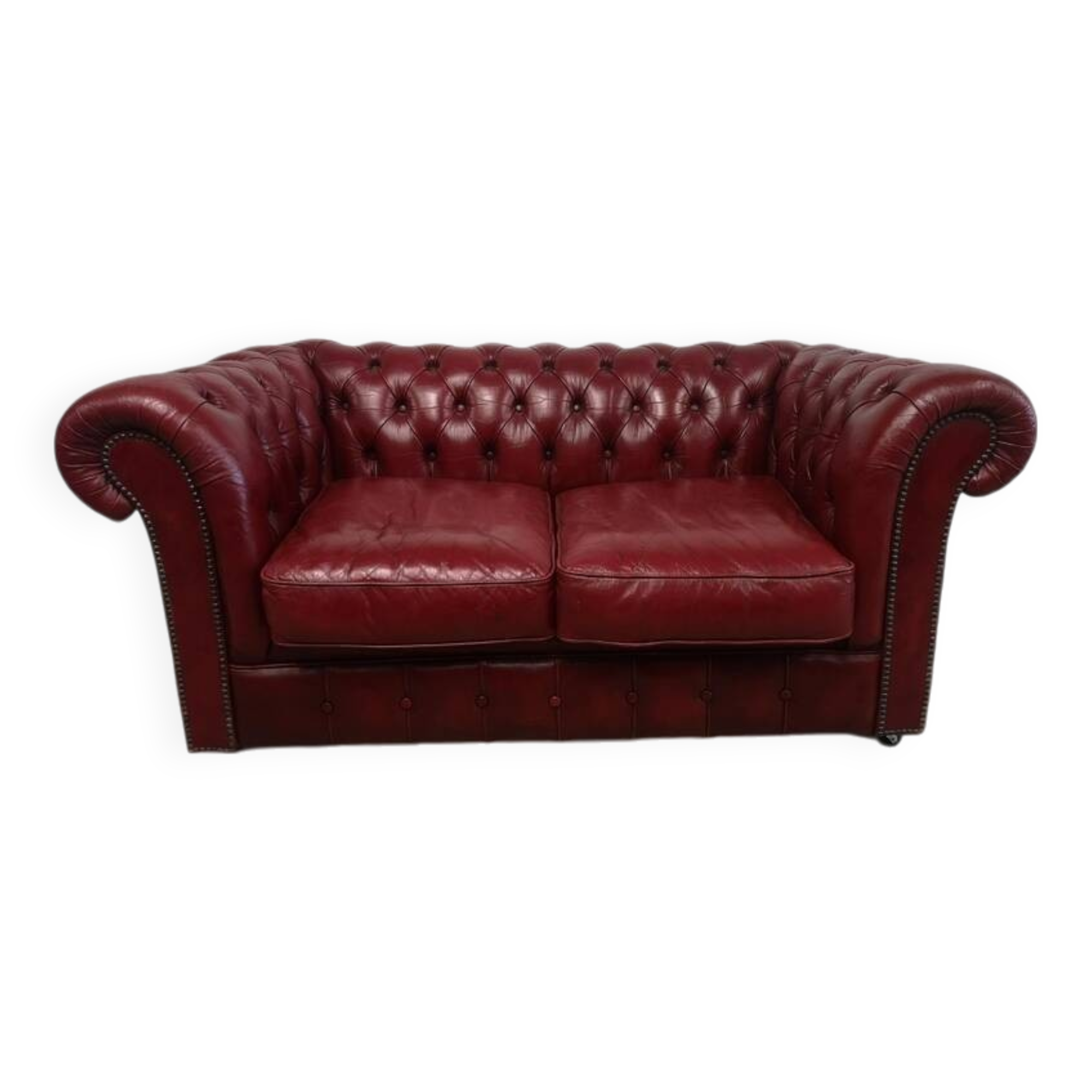 Red two-seater chesterfield sofa