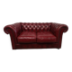 Red two-seater chesterfield sofa