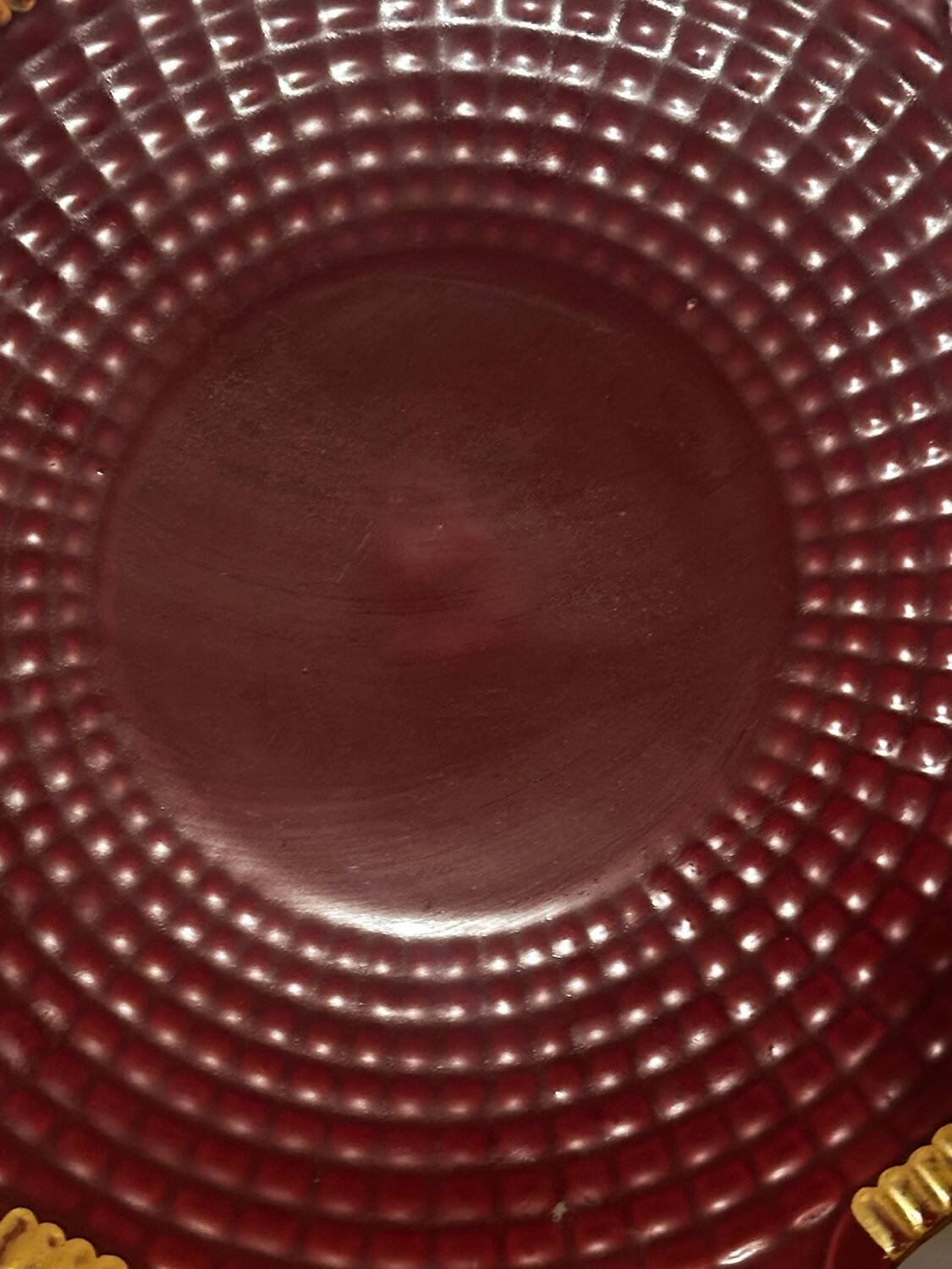 Burgundy and gold openwork plate in ceramic from Saint-Clement, 1950s.