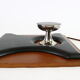 Two coat hangers, wood, leather and black leather, 70s
