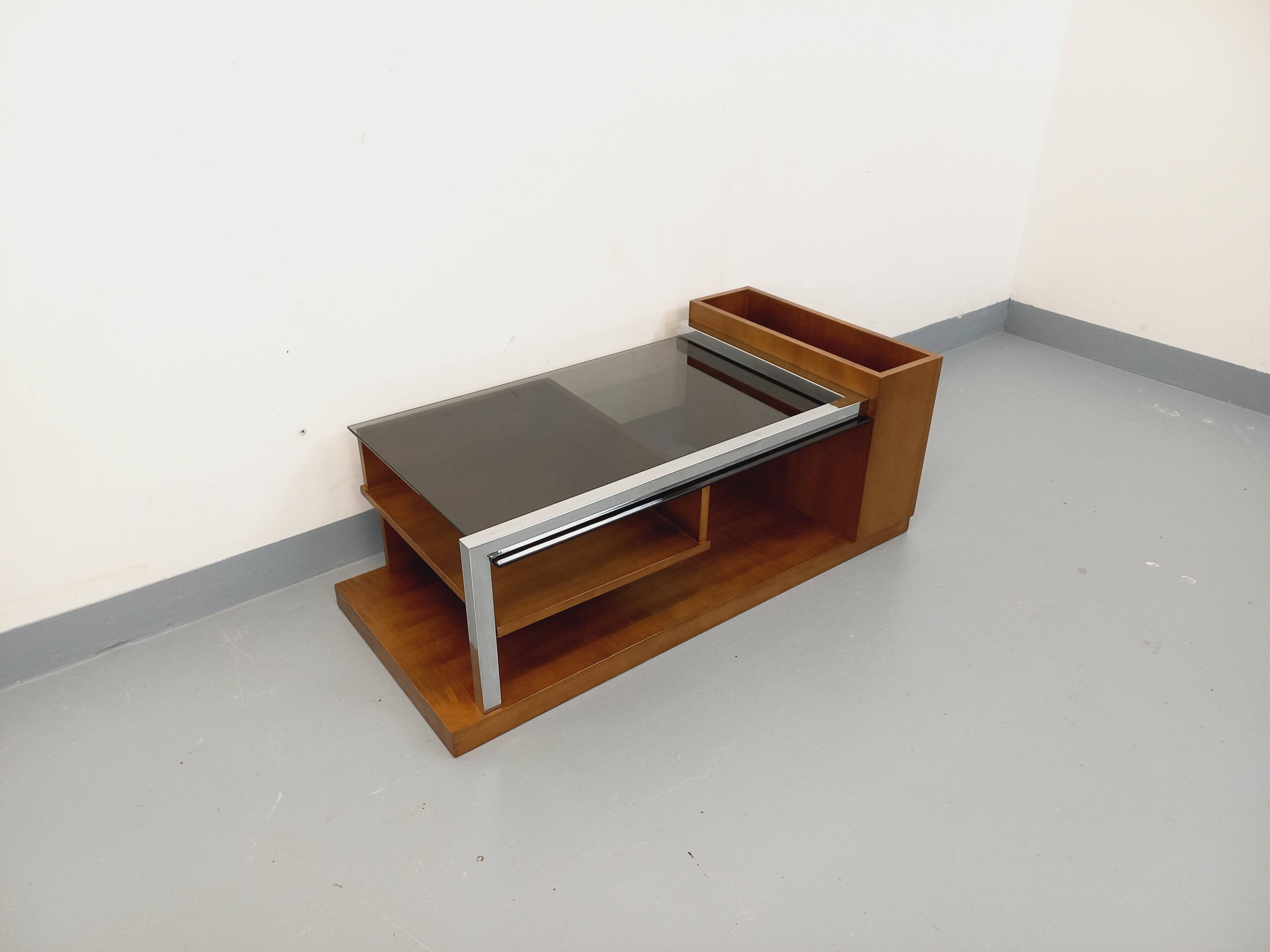 Rectangular vintage modernist coffee table with wooden niches, chrome.