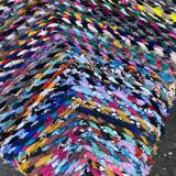 Wooden armchair braiding multicolored fabrics