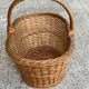 Round woven wicker basket with handle