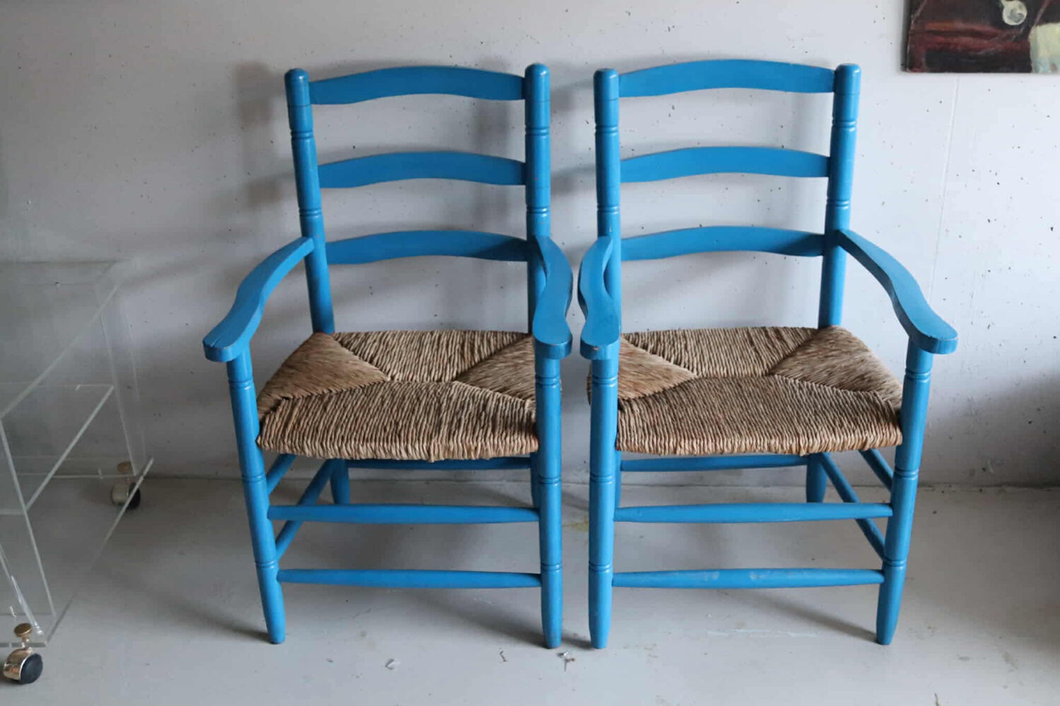 Pair of Provençal armchairs in painted wood and straw, around 1960.