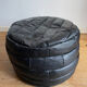 Patchwork black leather pouf de Sède