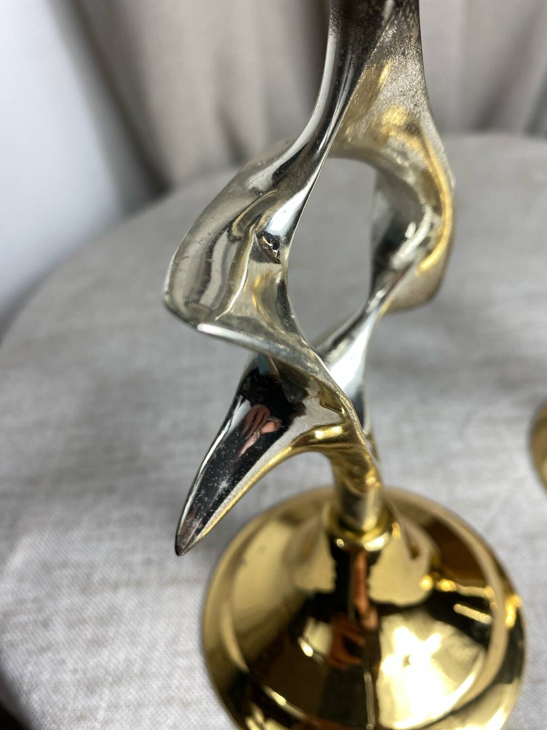 Pair of silver and gold metal candlesticks