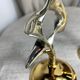 Pair of silver and gold metal candlesticks