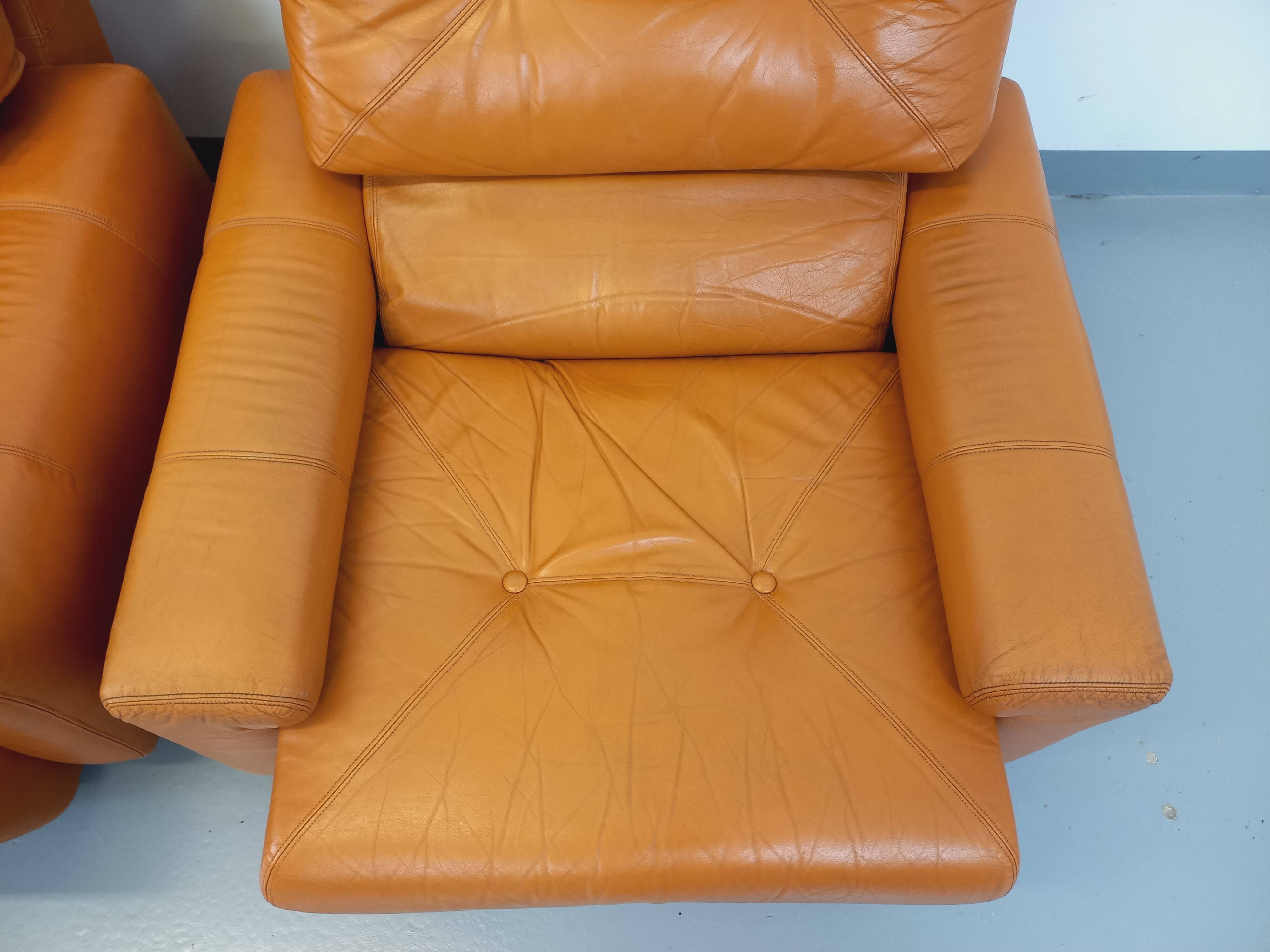 Pair of vintage leather lounge chairs from the 60s and 70s
