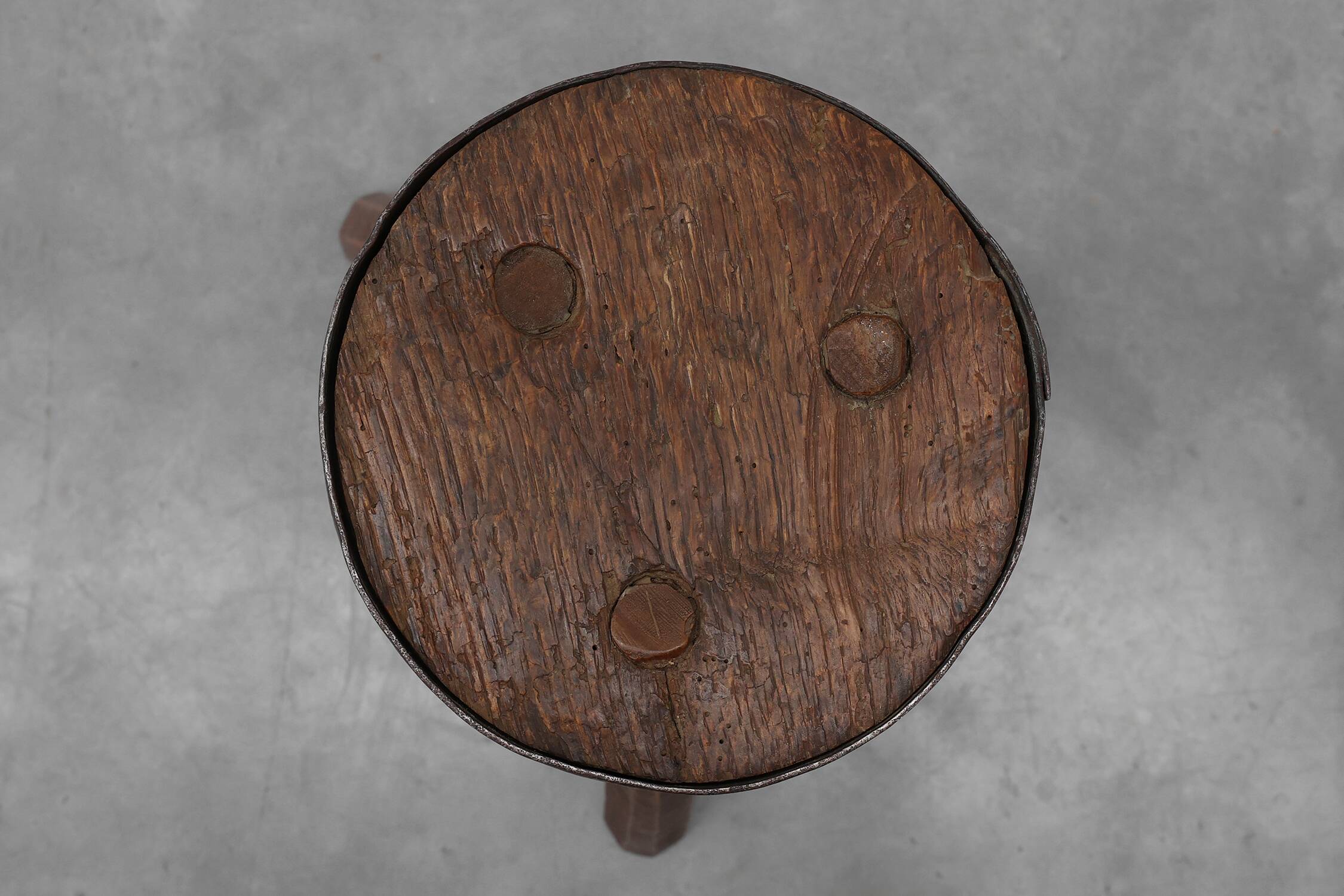 Brutalist French solid oak tripod stool with metal rim, 1850s