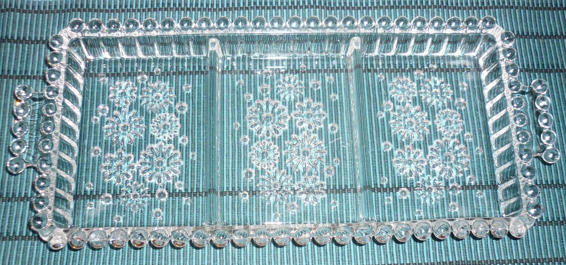 Antique dish in chiseled glass with pearls