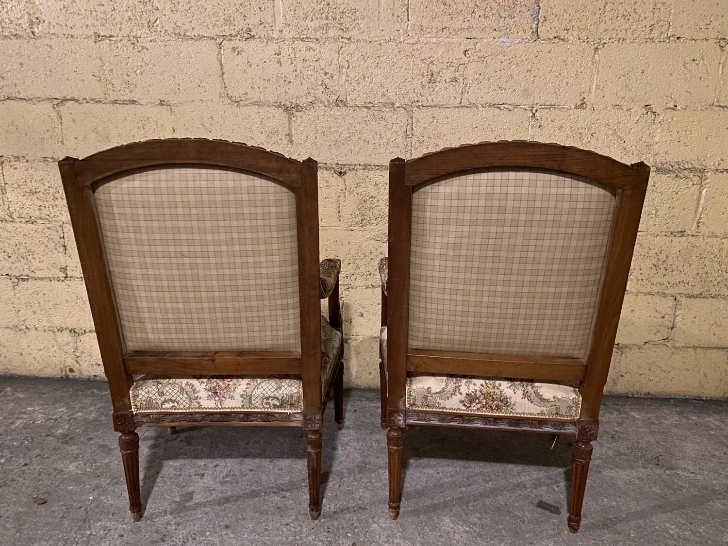Pair of antique carved wooden armchairs