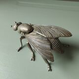Vintage metal fly, old ashtray to divert