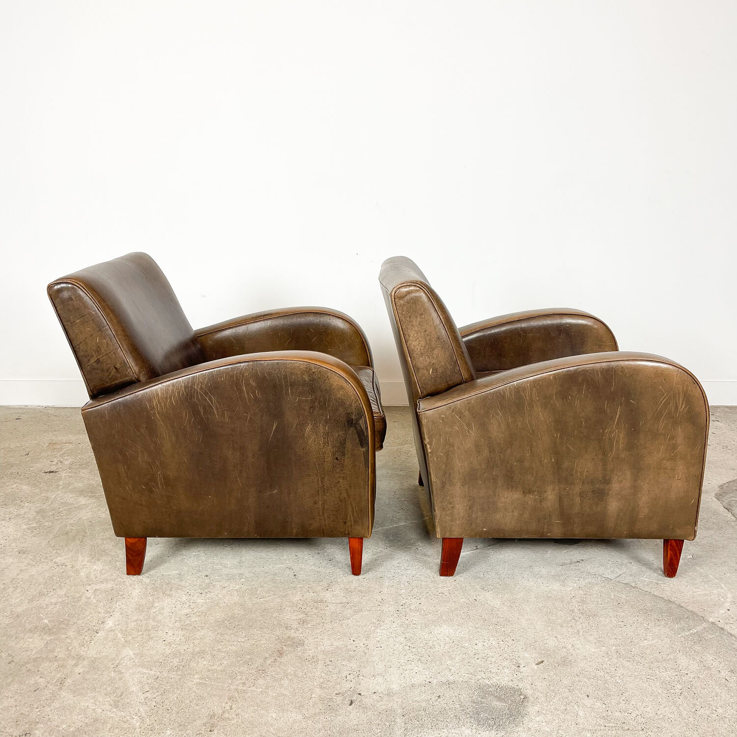 Set of two vintage leather wagon wheel armchairs Haarle