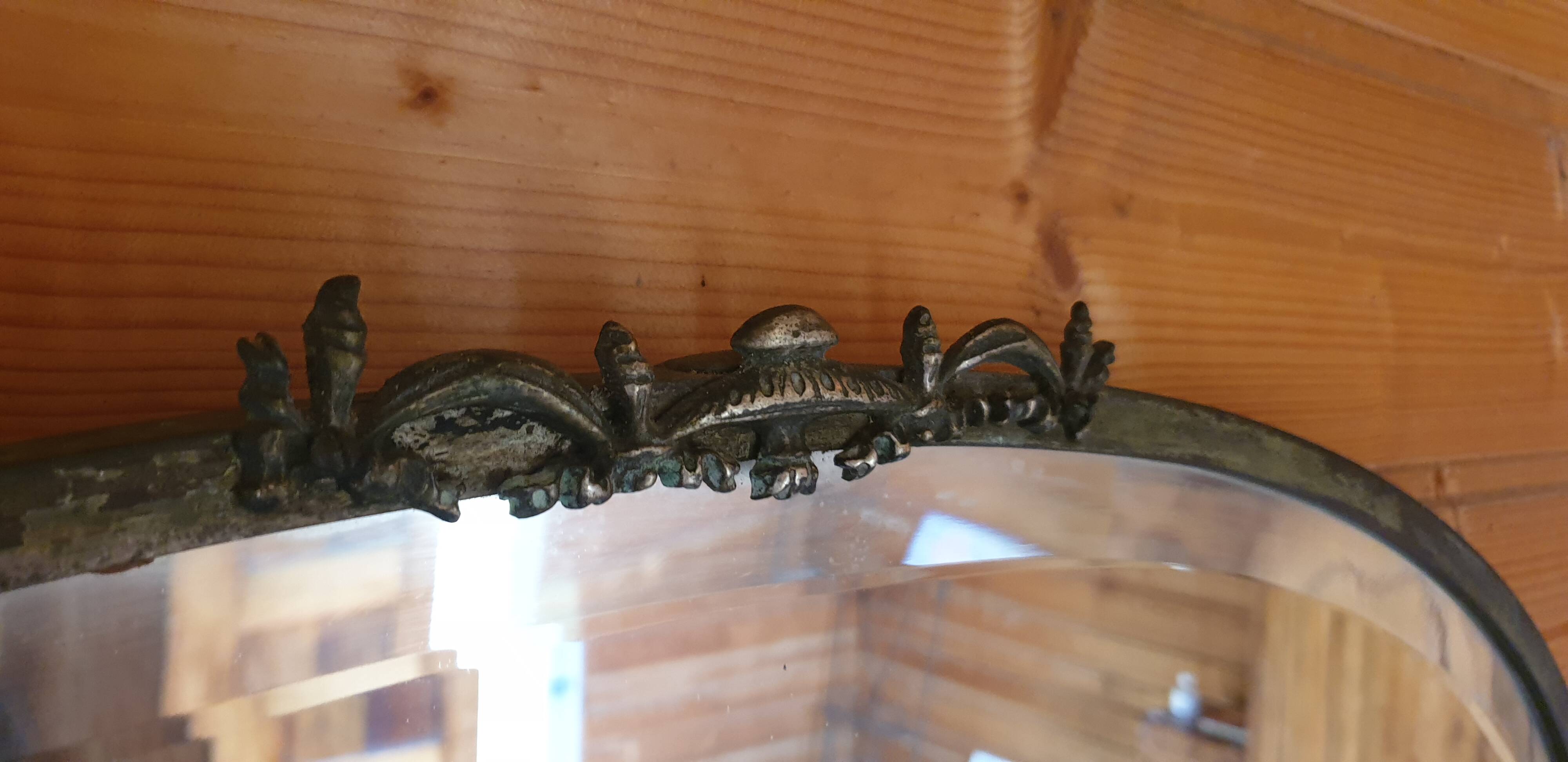 Oval beveled mirror with bronze frame - 19th century