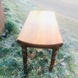 Extendable round table in walnut wood 1930