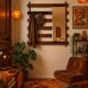 Vintage teak wall coat rack with 5 hooks and mirror.