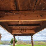 Old French farmhouse table in walnut with turned legs.
