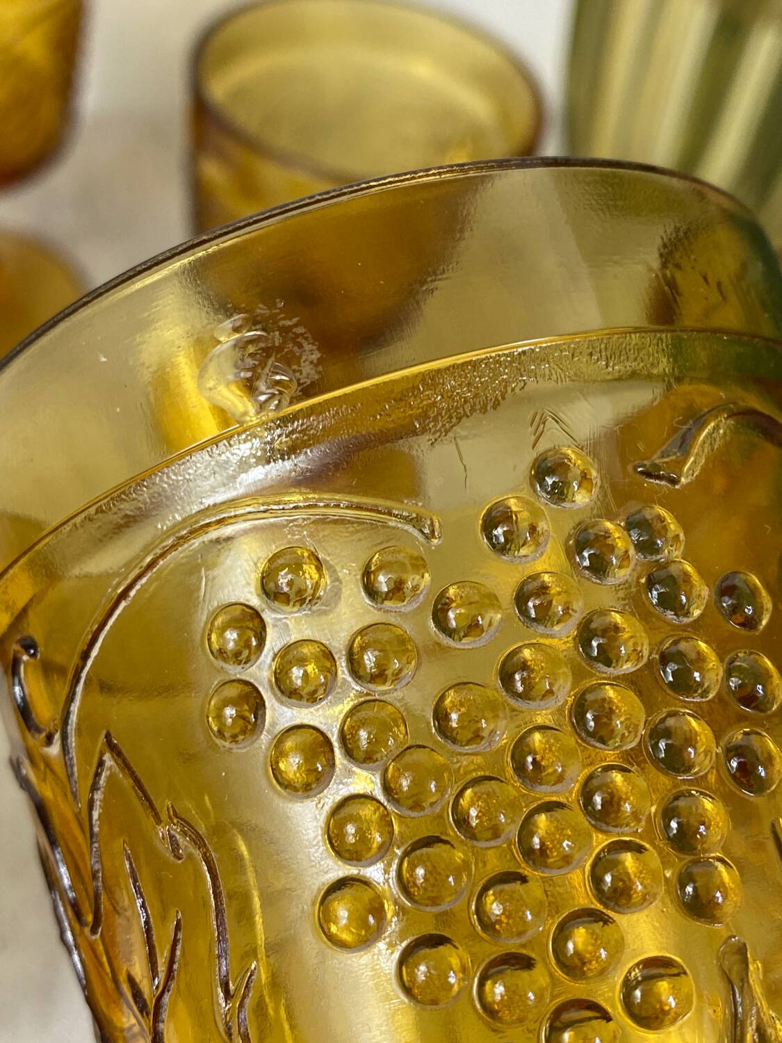 Six amber-colored stemmed glasses