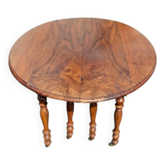8-legged walnut table with 5 flag extensions
