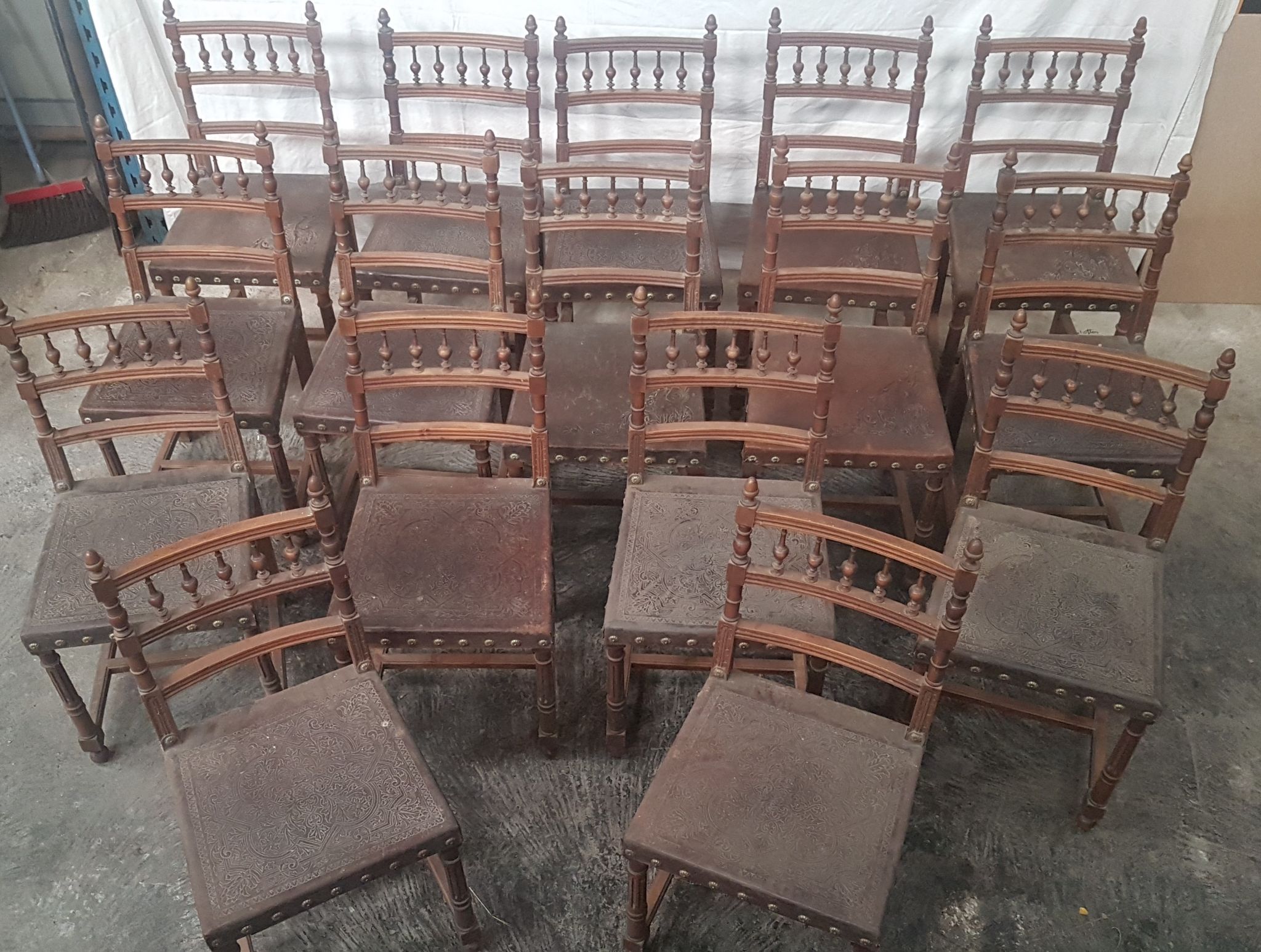 A set of 16 henri 2 style chairs in repelled leather 2 patterns