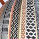 2 varnished solid wood chairs with "ethnic" padding