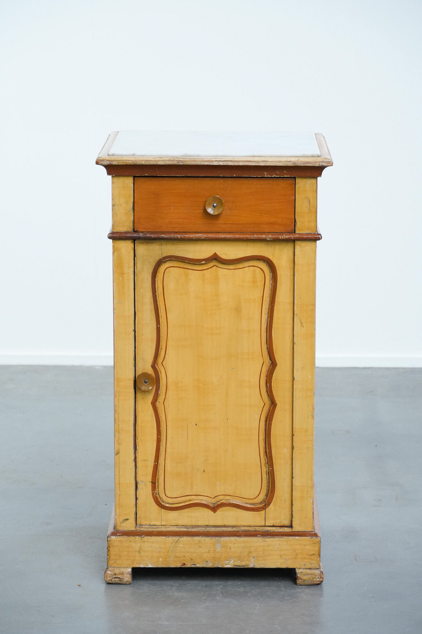 Antique wooden 1-door hallway/nightstand with a light marble top