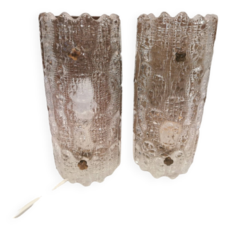 A pair of wall lights designed by Carl fagerlund for Lyfa Denmark in crystal glass and brass.