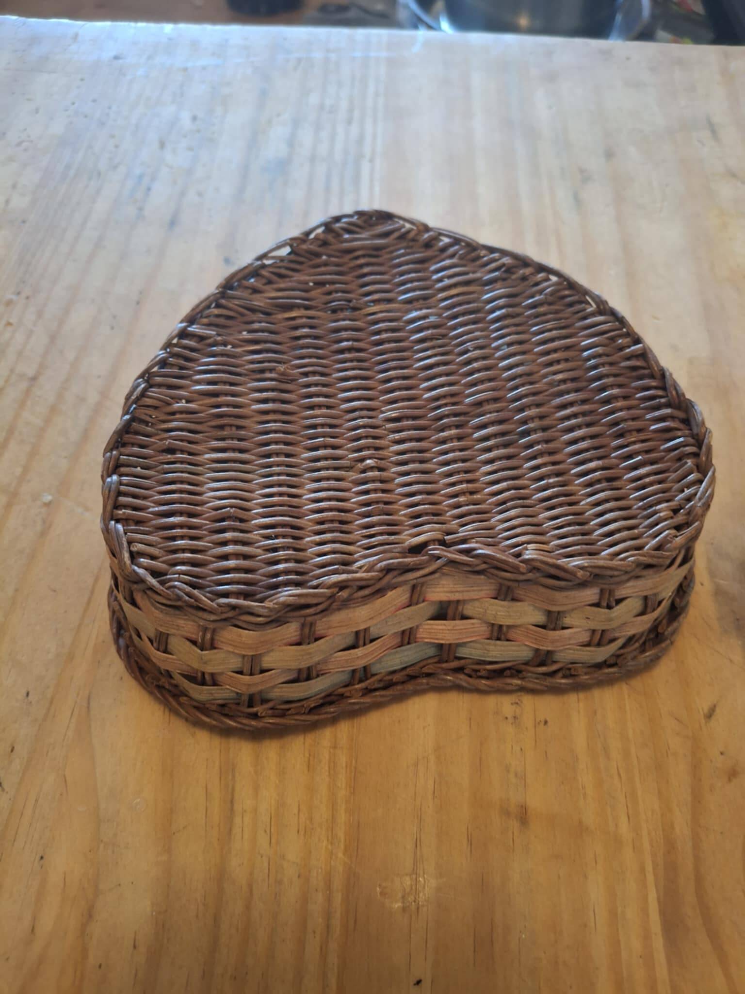Small wicker basket in the shape of a heart.