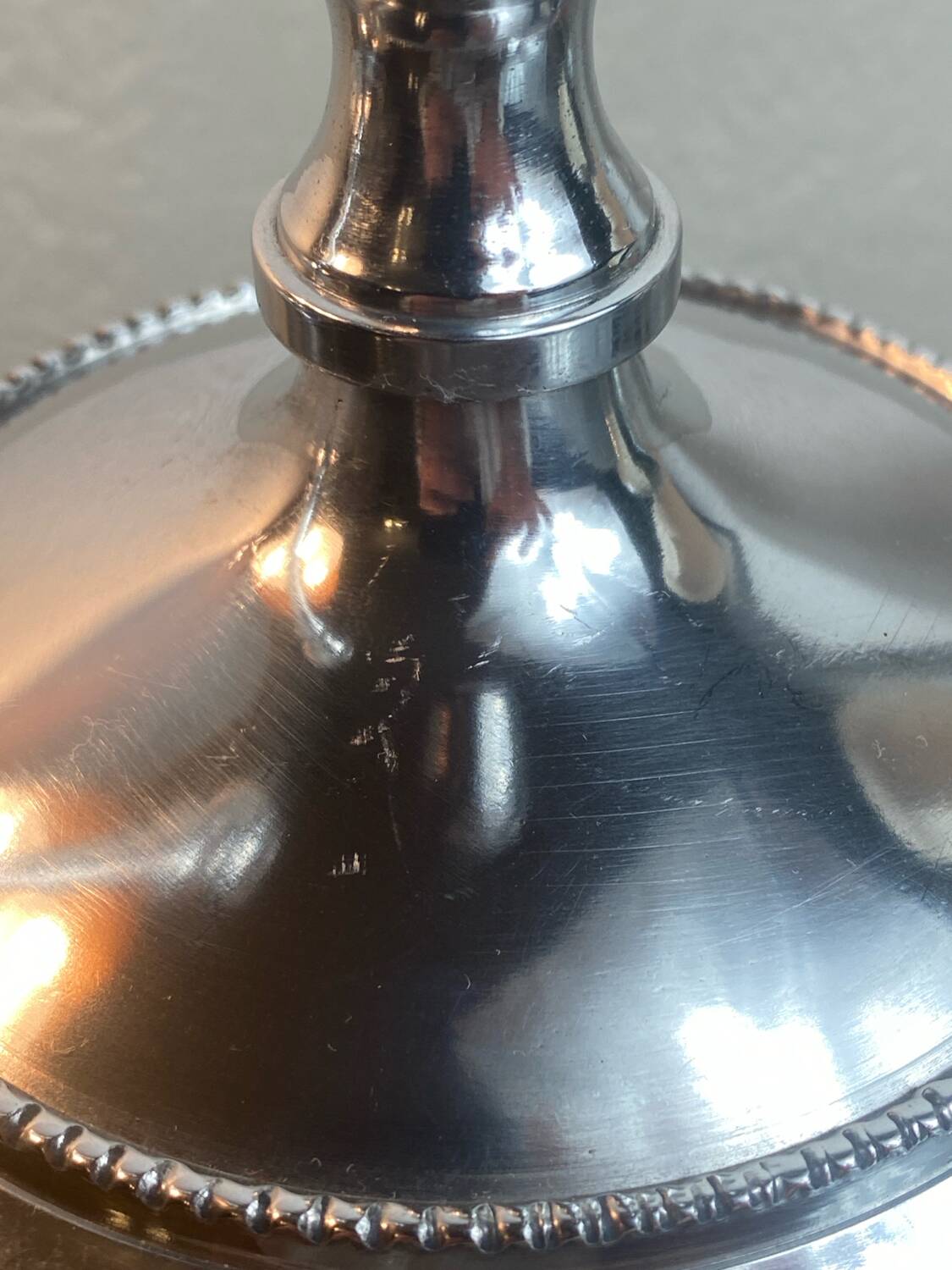 Pair of silver-plated metal candlesticks