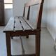 Large wooden bench with a backrest